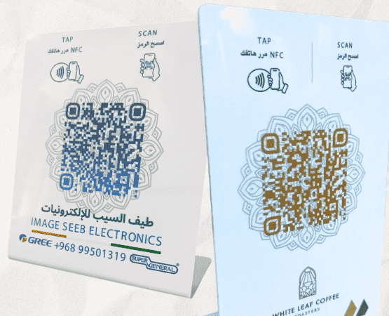 Two Koroot NFC desk stands, each printed with a business's branding and a tap-or-scan QR code